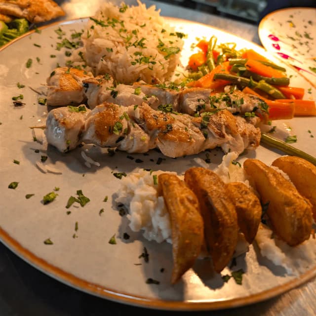 Outdoor food truck event scene with people.